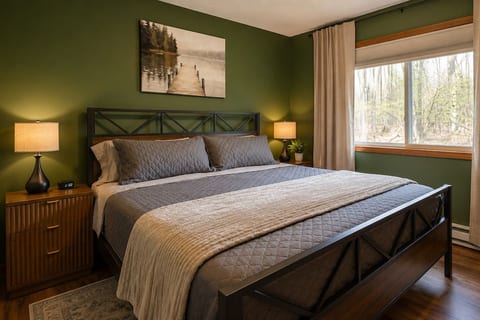 The primary bedroom features a king bed with plenty of storage space in the closet, bedside charging tables and touch lamps. You’ll have plenty of room to store your luggage in the closet or on the luggage rack.