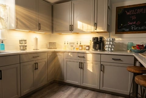 Sunny, stylish kitchen with coffee bar and cozy breakfast seating