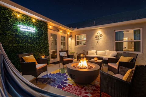 Cozy fire pit patio with stylish seating and ambient evening lighting