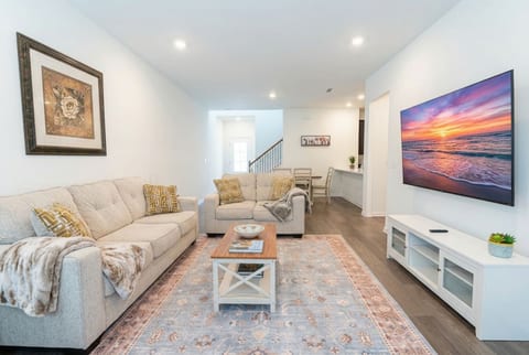Sink into plush seating in this sun-drenched living space, styled with coastal charm and everything you need to unwind after a day of Florida adventures