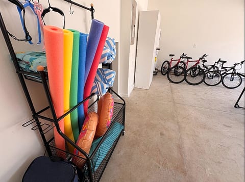 Garage stocked with bikes, pool gear, and beach-ready essentials