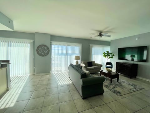 Living room with Smart blinds and 75" TV