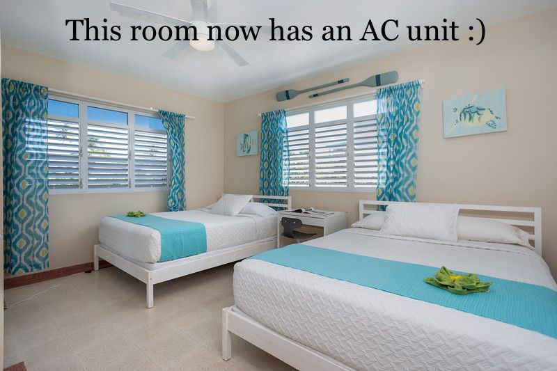 Oceanview Queen bedroom with new AC unit, shared desk and closet