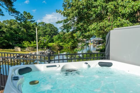 Relaxing hot tub with serene water views