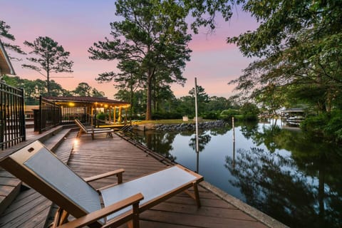 Tranquil lakeside retreat at sunset