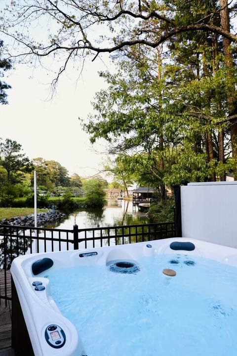 Serene hot tub by the water