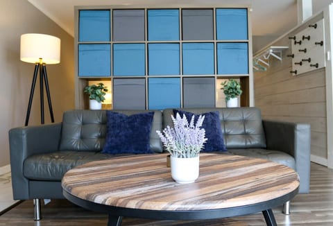 An open style living room. With full size couch and coffee table.