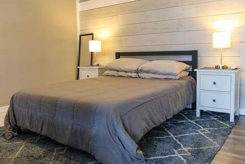 Queen size Tuft and Needle Bed with bedside stands.