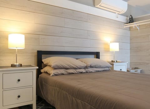 Queen bed with and Tuft and Needle mattress. Daikin Mini Split- cools the entire space!