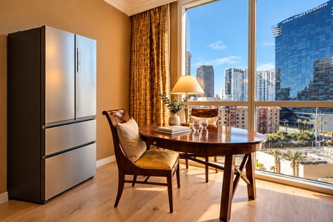 Enjoy Las Vegas city views from your sunlit dining nook, complete with updated tile flooring and a full-size refrigerator for a convenient stay.