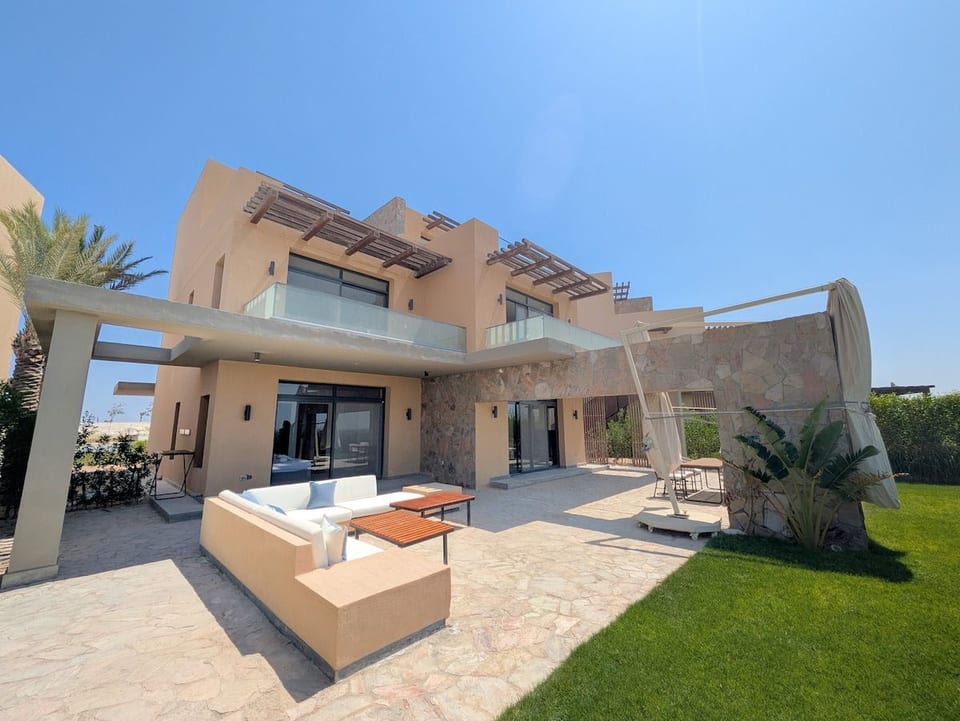 Relax in the sun or unfurl the parasol for some shaded peace, with sunset views of the bayside sea and mountains
