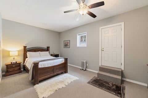 Queen Bed with door to back yard shown on the right.