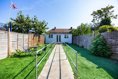 Enjoy a peaceful outdoor space with a private garden, seating area and easy-access pathway — perfect for a little fresh air during your stay
