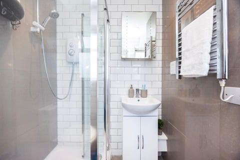 Enjoy a refreshing shower in the modern shower, with complimentary toiletries provided.