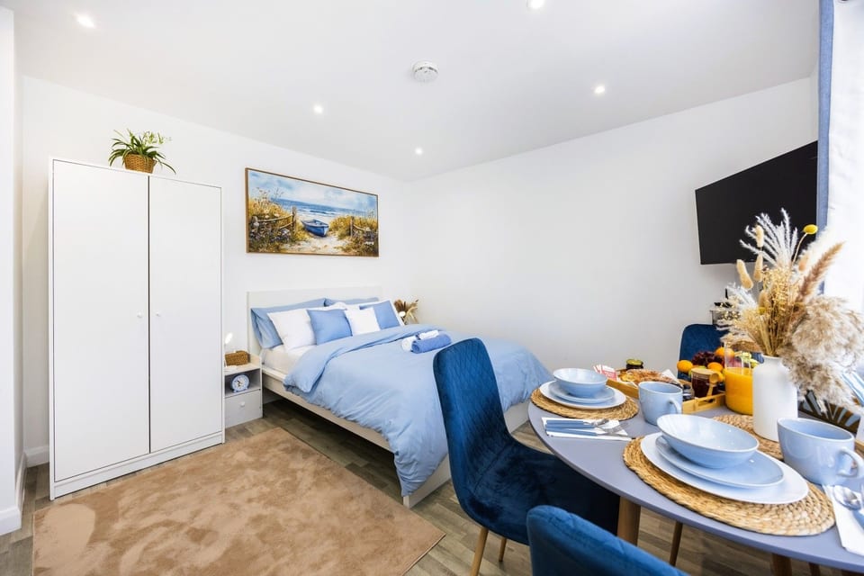Your home away from home: Serene and spacious studio with a comfortable bed, dining area, Smart TV and plenty of natural light
