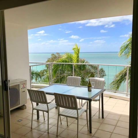 Relax with stunning ocean views from your private balcony, complete with comfortable outdoor seating