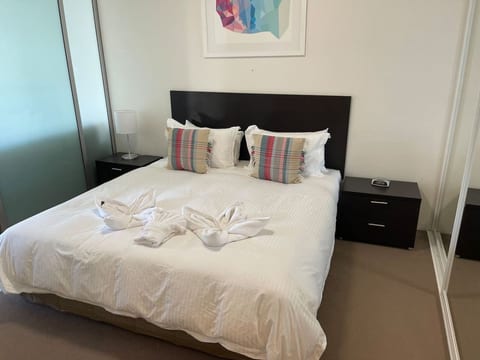 Comfortable bedroom with a neatly made queen bed