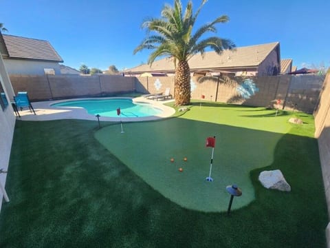 Backyard oasis 5 hole putting green and pool