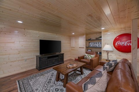 Lower floor living area with 65" TV, Foosball and Shuffleboard