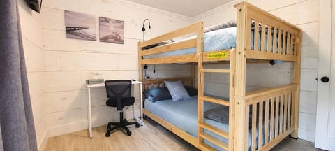Curl up with a good book in the comfortable full size bunk bed with lamps touch lamps with charging plugs. Or used the extra bedroom as an office.