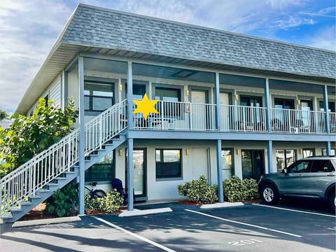 Second story end unit. Numbered parking space located right below, other spaces available labeled "No boats".