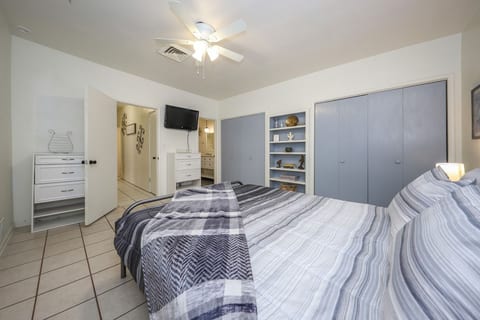 Cozy master bedroom with Roku and storage