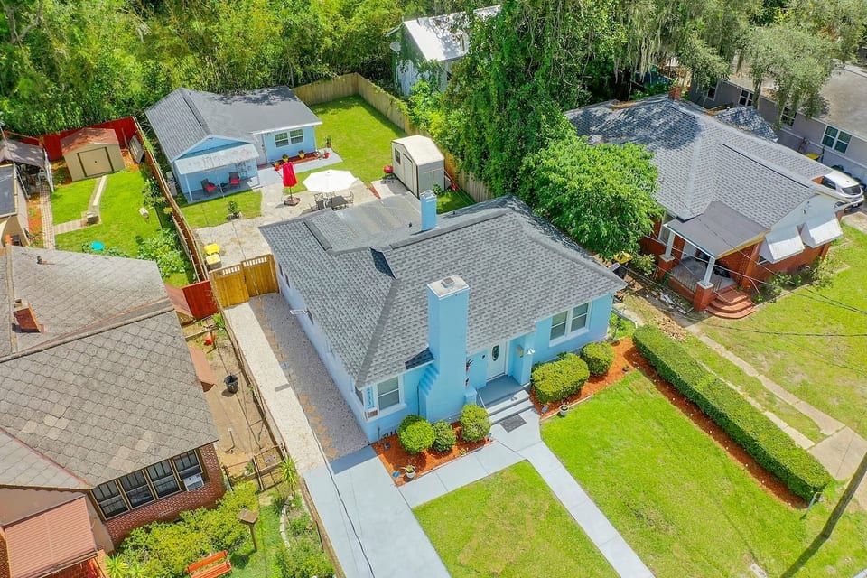 PROPERTY LAYOUT: Front House shown in foreground. Separate Guest House is located in the rear. Driveway and backyard are shared. Each home has a private entrance.