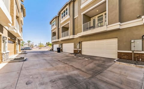 Modern tri-level homes with 2-car garages, private balconies, easy access.