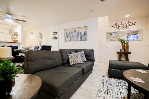 Stylish open-plan living with cozy sectional near dining & kitchen