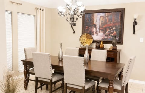 Elegant dining area with seating for six, perfect for shared meals and gatherings.