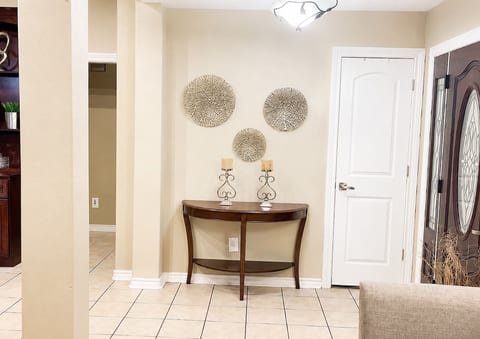 Welcoming entryway with tasteful decor and an open inviting feel.
