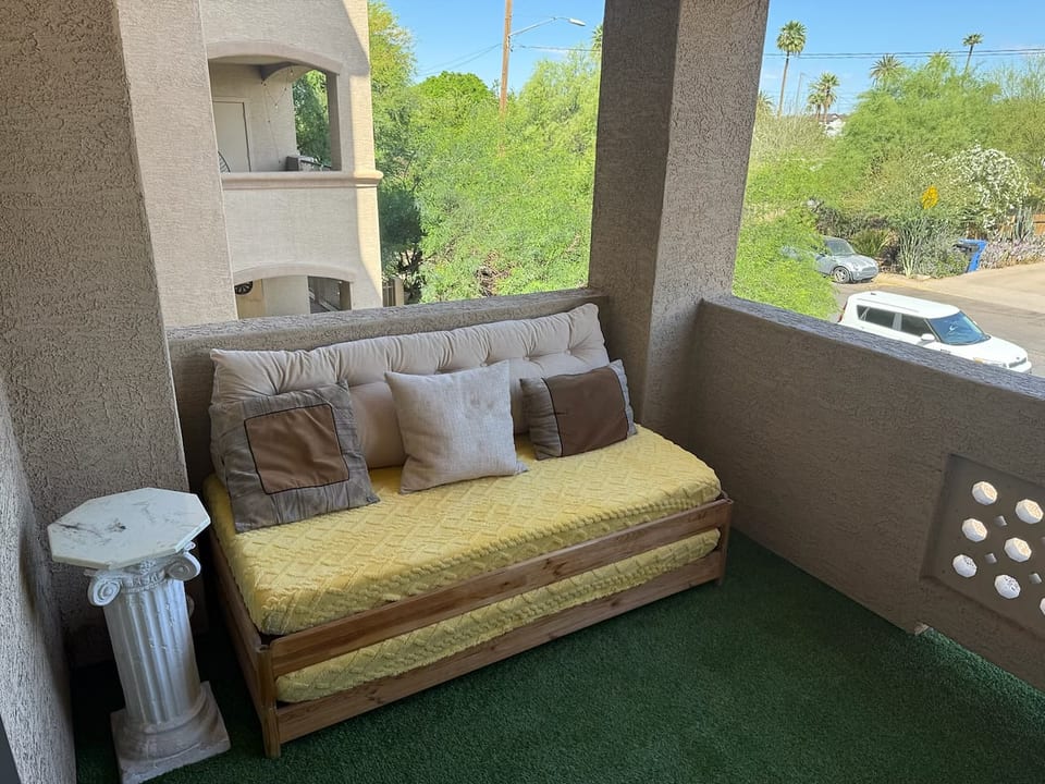 Comfy spacious covered outdoor balcony with views