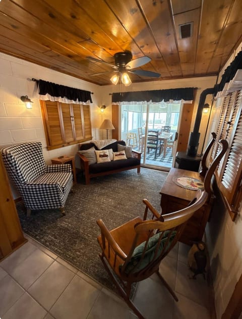 Family room with chairs and a futon with a youth bed.