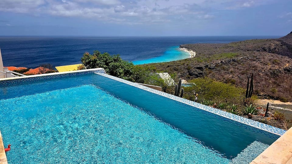 Where our infinity pool ends, the blues of Cas Abao begin