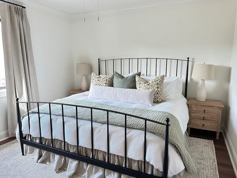 King bedroom with luxury bedding and blackout curtains