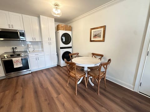 Full sized washer and dryer located in kitchen