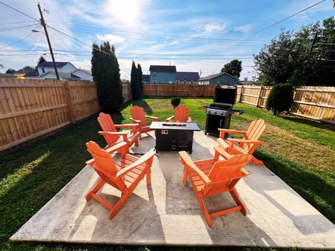 Relax around the firepit with friends and family in your private backyard retreat. This spacious fenced yard features Adirondack seating, a cozy firepit, and a Weber grill — perfect for evenings of good food, laughter, and unforgettable memories.