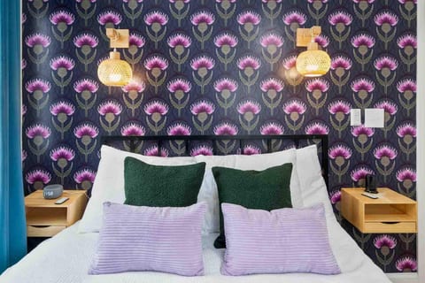 Comfortable Queen Bed with Purple Mattress in Second Bedroom