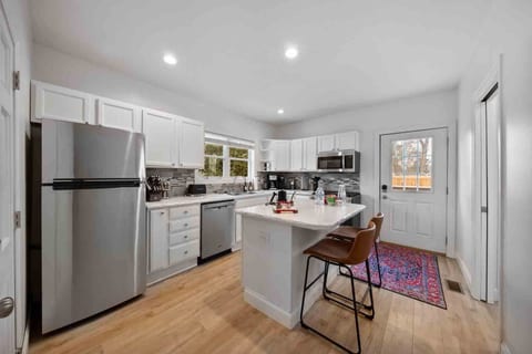 The updated kitchen has all the essentials you need to prepare delicious meals, from stainless steel appliances to cookware, spice rack and utensils.
