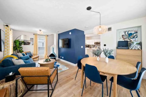 Gather around the dining table, conveniently located just off the kitchen and open to the living room. This open-concept design allows for effortless flow between cooking, dining, and relaxing.