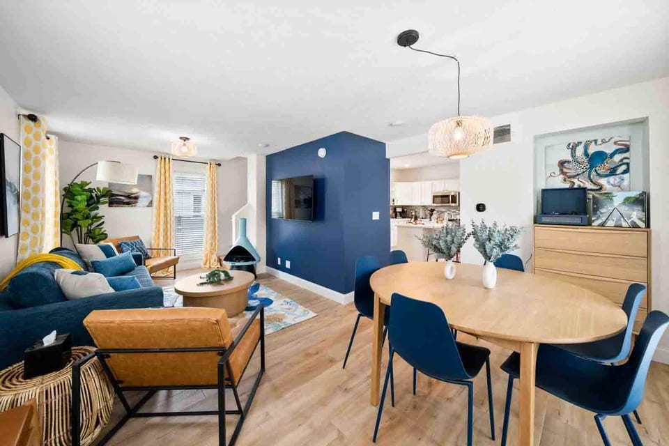 Gather around the dining table, conveniently located just off the kitchen and open to the living room. This open-concept design allows for effortless flow between cooking, dining, and relaxing.