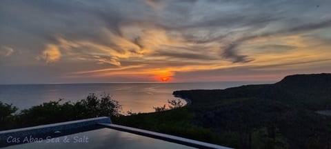 Sunset clouds lighting up the Caribbean horizon