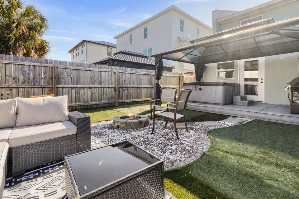 Private backyard with fire pit, hot tub & grill area 