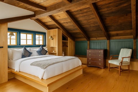 Wake up under exposed beams in this cozy loft bedroom.