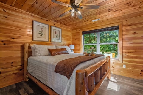 Downstairs king bedroom with peaceful wooded views