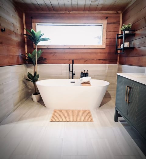After a day of outdoor exploring, relax and unwind in our brand new spa like primary bath with soaking tub