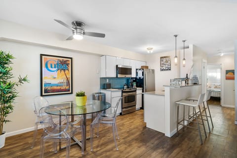 Share meals, plan beach days, or sip wine around this breezy dining nook with a touch of coastal flair.