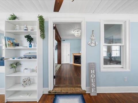 Step inside to breezy coastal style—bright blues, warm wood, and a space that instantly feels like vacation.