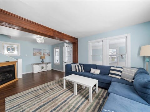 Relax on the spacious sectional after a beach day—stream movies, sip wine, or enjoy the warmth of the fireplace.