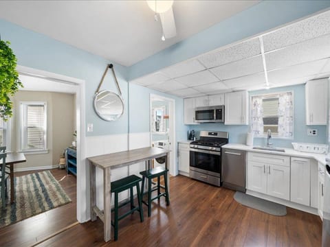 Relax after a day in the sun—this comfy living room invites conversation, board games, or movie nights in.